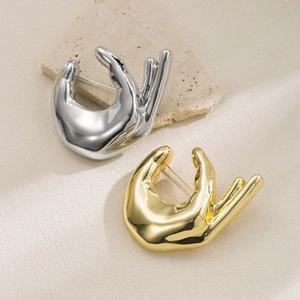 Elegant gold and silver OK hand gesture pins with high-polished metallic finish