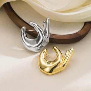 Creative OK gesture metal brooches in silver and gold plating for chic clothing decor