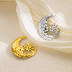 Vintage sun and moon brooch set in gold and silver finish with detailed facial relief