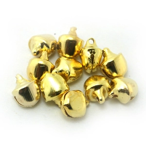 Golden acorn-shaped metal bells with hanging loops for DIY crafts and holiday decor