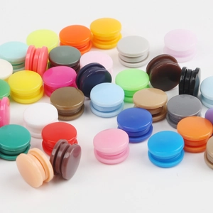 Set of colorful resin snap buttons in multiple shades for DIY children's clothing crafts