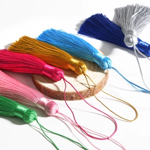 Set of seven colorful decorative silk tassels with hanging loops for DIY crafts and decor