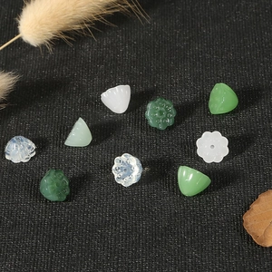 Macro detail of faux jade lotus pod beads for DIY traditional Chinese jewelry making