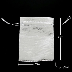 Detailed view of silver drawstring organza bags with dimensions 7x9cm 10 pieces pack
