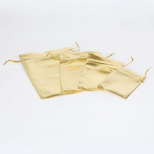 Set of four gold drawstring pouches in gradient sizes for jewelry and gift packaging