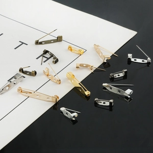 Assorted sizes of metal pin backs in multiple colors for DIY brooch and badge making