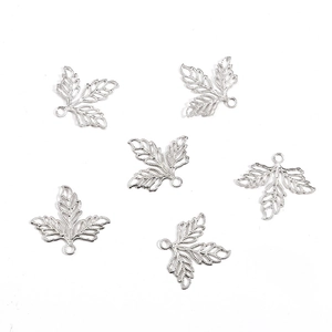 Detailed view of silver hollow maple leaf charms for DIY handmade hair jewelry making