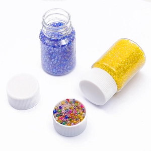 DIY jewelry kit with 2mm colored glass seed beads in blue, yellow, and mixed bottles