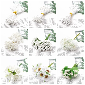 Assortment of white artificial flowers and stamens for DIY handmade floral crafts