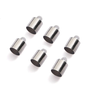Detail of silver-colored round metal cord ends with loop rings for jewelry making