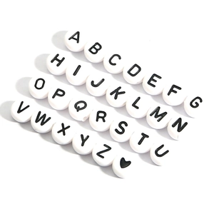 DIY acrylic alphabet beads set with black letters A-Z and heart pattern on white round discs