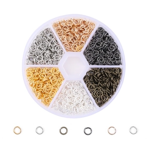 Detailed view of six-compartment storage box with multicolor metal DIY jump rings