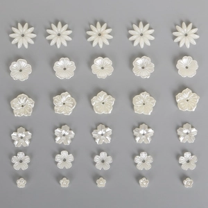 White ABS pearl flower beads in various petal designs for DIY jewelry and hair accessories