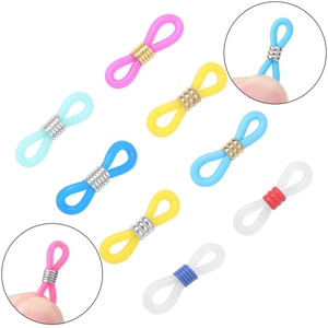 Macro view of colorful silicone eyeglass chain connectors with metal spring coils