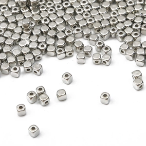 Macro detail of silver square CCB spacer beads with center holes for DIY jewelry making