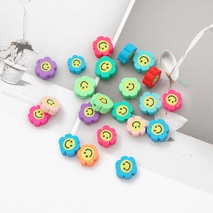 Macro shot of colorful polymer clay flower smile beads for DIY jewelry and earrings