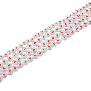 Handmade DIY craft beads with translucent white finish and red heart patterns for jewelry
