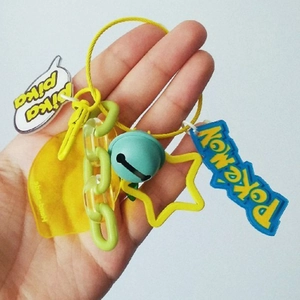 Colorful Pokemon theme keychain with yellow star ring, blue bell and green plastic chain