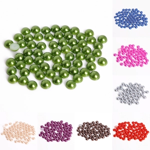 Close-up of assorted colorful half-round ABS faux pearls for DIY crafts and jewelry making