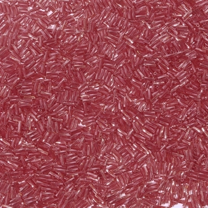 Macro detail of translucent rose red glass bugle beads for DIY jewelry and embroidery