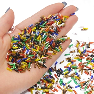 Colorful twisted bugle glass beads for DIY jewelry and embroidery crafts in hand