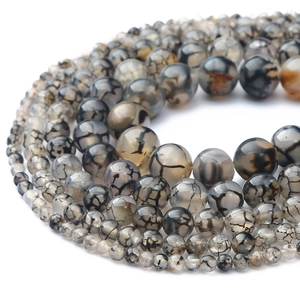 Detail van natuurlijke zwarte drakenaderagaat kralen met spinnenwebpatroon voor DIY sieraden