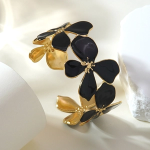 Elegant gold-plated flower cuff bangle featuring black enamel petals for women