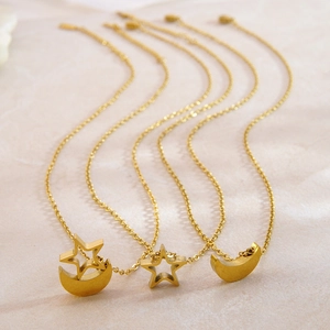Three minimalist gold stainless steel necklaces featuring celestial moon and star pendants