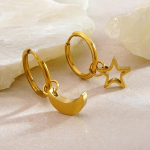 Polished gold stainless steel asymmetric earrings with star and moon charms on stone
