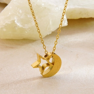 Minimalist stainless steel gold necklace with star and moon pendant on white stone