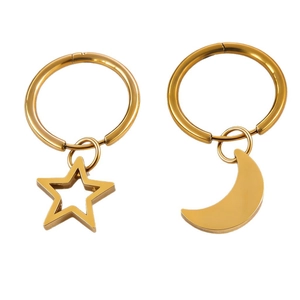 Golden stainless steel hoop earrings featuring hollow star and solid moon celestial pendants