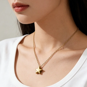 Minimalist gold star pendant necklace for women with a delicate fine link chain