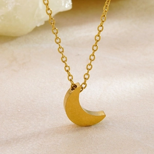 Elegant gold crescent moon pendant necklace with matte finish on delicate chain