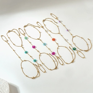 Bohemian gold plated hand chain with colorful bead flowers and adjustable lobster clasp