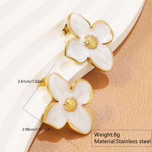 Detail view of floral stainless steel earrings with white enamel and golden edges