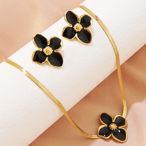 Stainless steel jewelry set featuring black enamel plumeria earrings and snake chain necklace