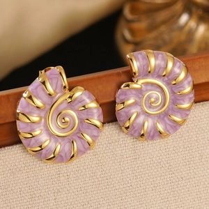 Detail of seashell earrings with golden frame and purple marbled enamel textures