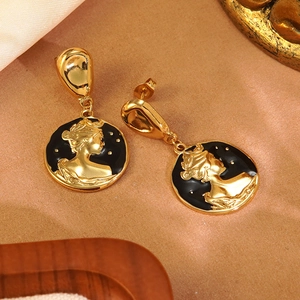 Detail of vintage queen cameo earrings in gold and black enamel with 304 stainless steel
