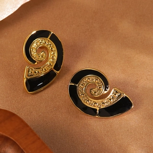 Vintage gold plated spiral earrings with black enamel and gold bead texture accents
