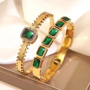 Elegant gold-tone stainless steel bracelets set with green zircon stones on silk