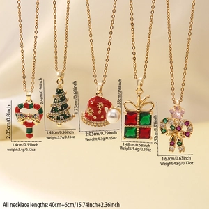 Detail view of colorful enamel Christmas tree and gift pendants with sizing data
