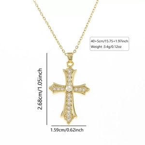 Detailed view of gold cross pendant showing dimensions 2.68x1.59cm and zircon inlay