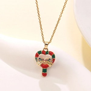 Detailed close-up of heart-shaped candy cane pendant with a colorful zircon bow on gold chain
