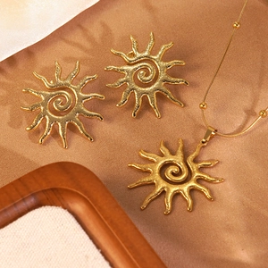 Golden sun hollow-out pendant necklace and earrings set with flame spiral texture