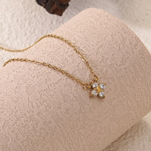 18k gold plated stainless steel necklace featuring a zircon flower pendant on a column