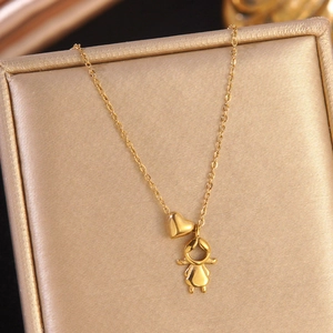 Polished 18k gold plated stainless steel necklace with heart and girl charms on gold satin