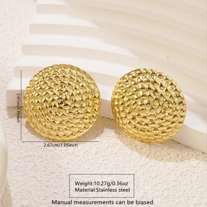Detailed view of large gold stainless steel scale texture earrings showing 2.67cm diameter