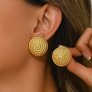 Gold stainless steel textured round stud earrings set with bold geometric woven surface
