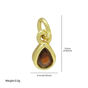 18k gold plated brass pear shaped pendant with red garnet stone measuring 9.2mm by 4.1mm
