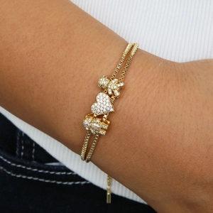 Bracciale dorato a doppia catena con ciondoli a cuore e bimbi e zirconi brillanti